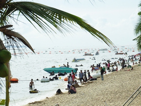 Tourists flock to the beaches over the long Labor Day weekend.